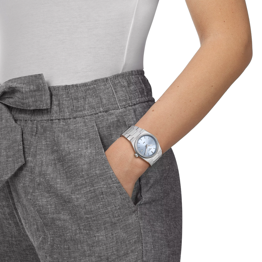 RELOJ TISSOT PRX, CUARZO, ESFERA CELESTE, BRAZALETE DE ACERO, FECHA, 35 MM