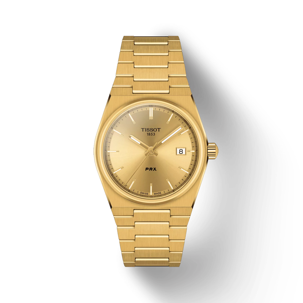 RELOJ TISSOT PRX, CUARZO, ESFERA DORADA, BRAZALETE DE ACERO PVD TONO ORO, FECHA