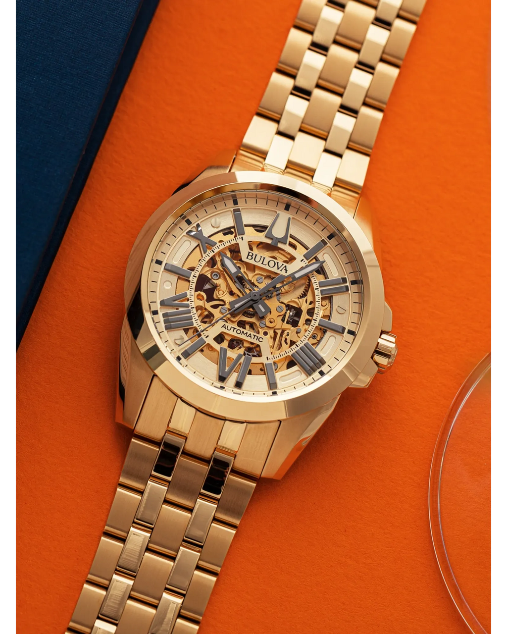 RELOJ BULOVA SUTTON, AUTOMATICO, ESFERA DORADA, BRAZALETE DE ACERO PVD ORO AMARILLO, 43 MM