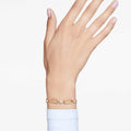 PULSERA SWAROVSKI CONSTELLA BLANCA, BAÑO TONO ORO, TALLA M