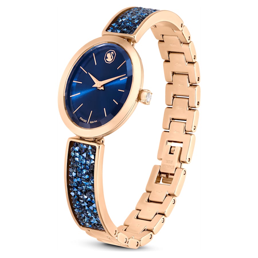 RELOJ SWAROVSKI CRYSTAL ROCK OVAL BRAZALETE DE ACERO INOXIDABLE TONO ORO ROSA, ESFERA AZUL, MOVIMIENTO CUARZO, CAJA 26 MM, MUJER