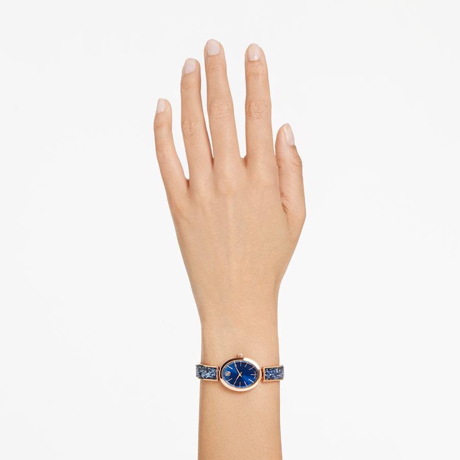 RELOJ SWAROVSKI CRYSTAL ROCK OVAL BRAZALETE DE ACERO INOXIDABLE TONO ORO ROSA, ESFERA AZUL, MOVIMIENTO CUARZO, CAJA 26 MM, MUJER