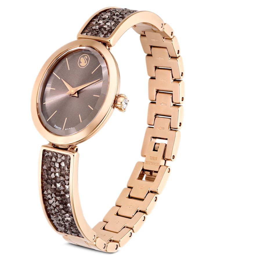 RELOJ SWAROVSKI CRYSTAL ROCK OVAL, BRAZALETE DE ACERO PVD ORO ROSA, ESFERA CAFÉ, CUARZO