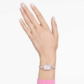 RELOJ SWAROVSKI DEXTERA, ACERO INOXIDABLE PVD TONO ORO CHAMPCÁN, ESFERA PLATEADA, MOVIMIENTO CUARZO, CAJA 31 X 19 MM, MUJER