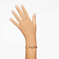 PULSERA SWAROVSKI ELEGANCE OF AFRICA, CORTES MIXTOS, MARRCÓN, BAÑO EN TONO ORO, TALLA M