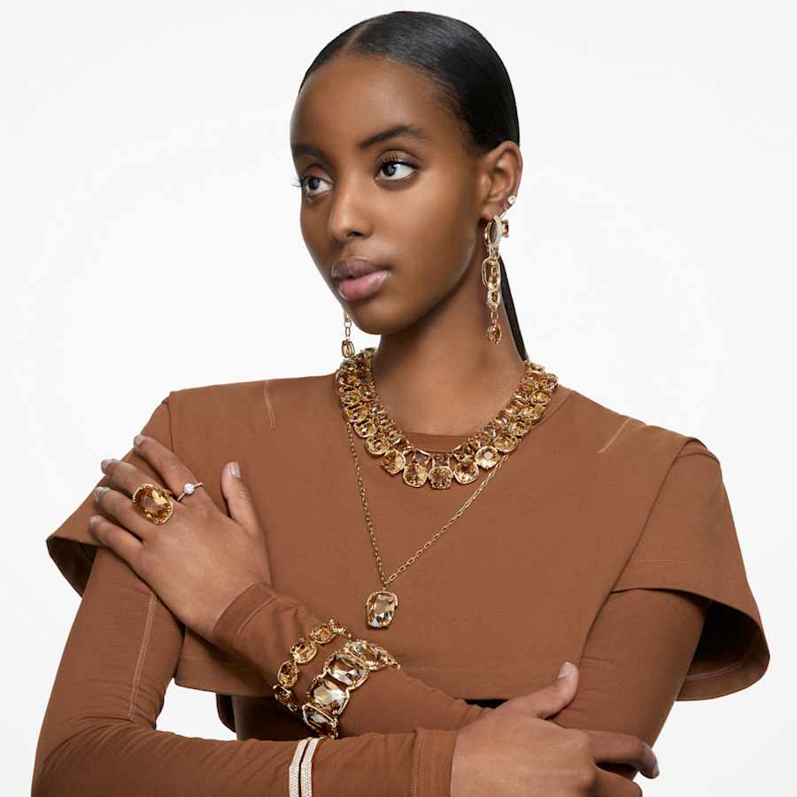 PULSERA SWAROVSKI HARMONIA, CRISTALES FLOTANTES DE GRAN TAMACÑO, TONO ORO, BAÑO TONO ORO, TALLA M