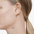 ARETES SWAROVSKI MATRIX TALLA REDONDA, BLANCO, BAÑO TONO ORO