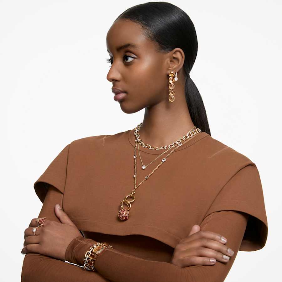 ARETES SWAROVSKI CONSTELLA TALLA REDONDA, BLANCO, BAÑO TONO ORO